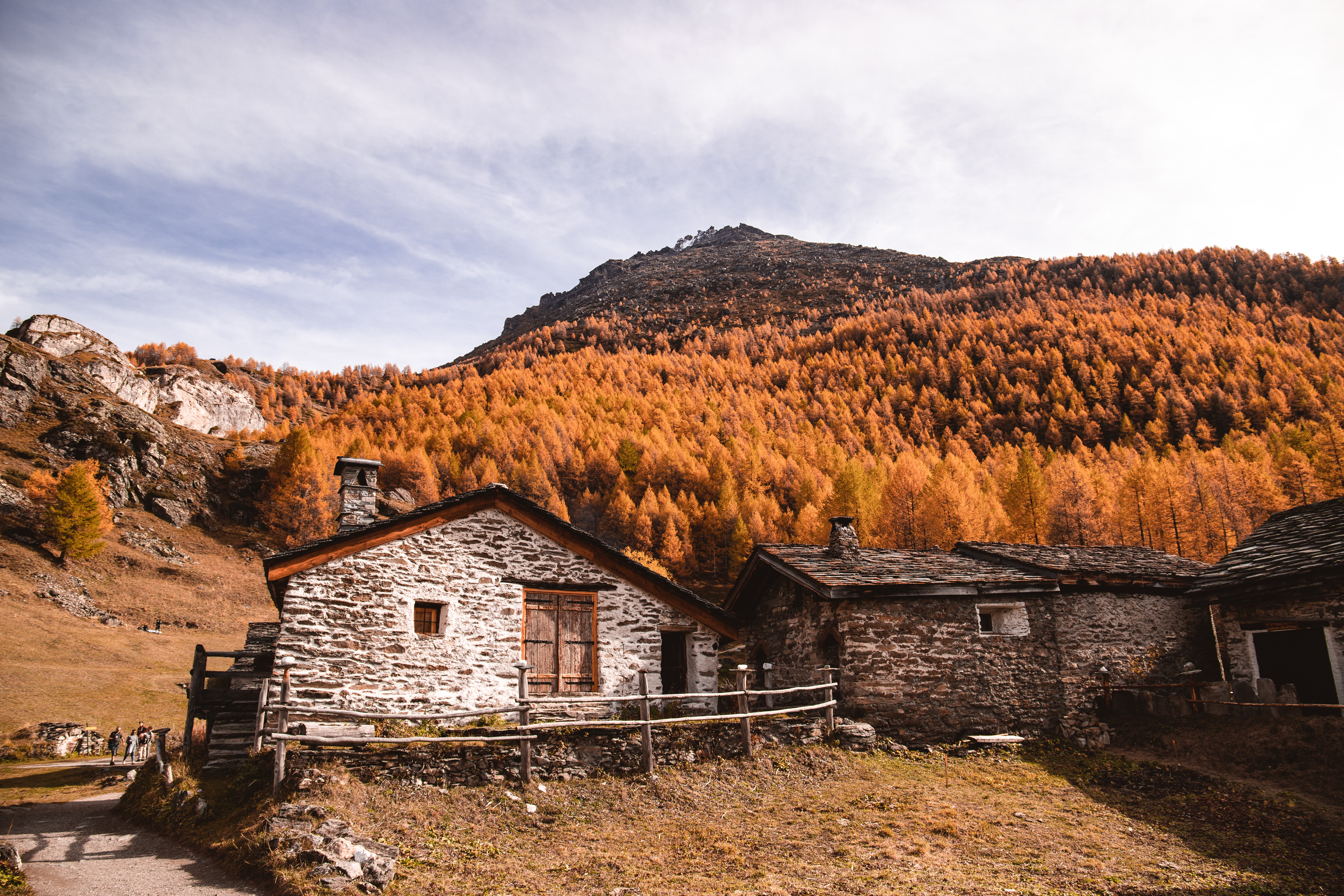 a stone house in the mountains
